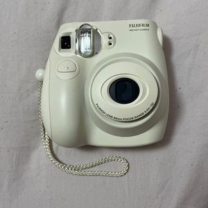 Polaroid camera with a case,package of film, five lenses and picture frames.